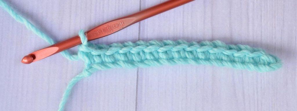 One row of single crochet stitches made by a right-handed crocheter