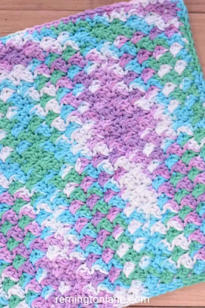 Crochet cotton grit stitch washcloth in Lily Sugar'n Cream beach ball blue colorway