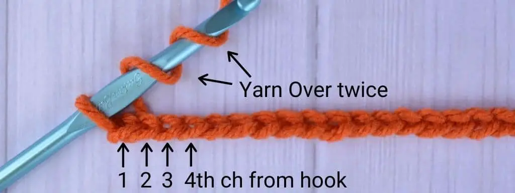 First step to left-handed treble crochet stitch