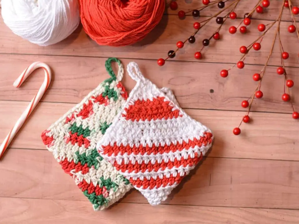 Folded holiday washcloths with red and white stripes, red and green multi-colors
