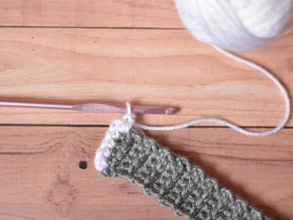 Close up of crochet headband where the border has just been started