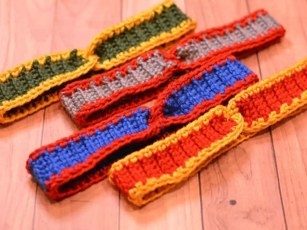 Four crochet headbands in a variety of professional football team colors
