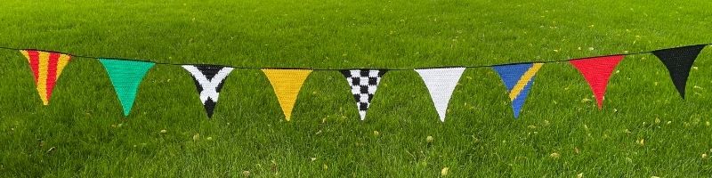 The hanging view of nine colorful pennants designed to mimic flags used during car races