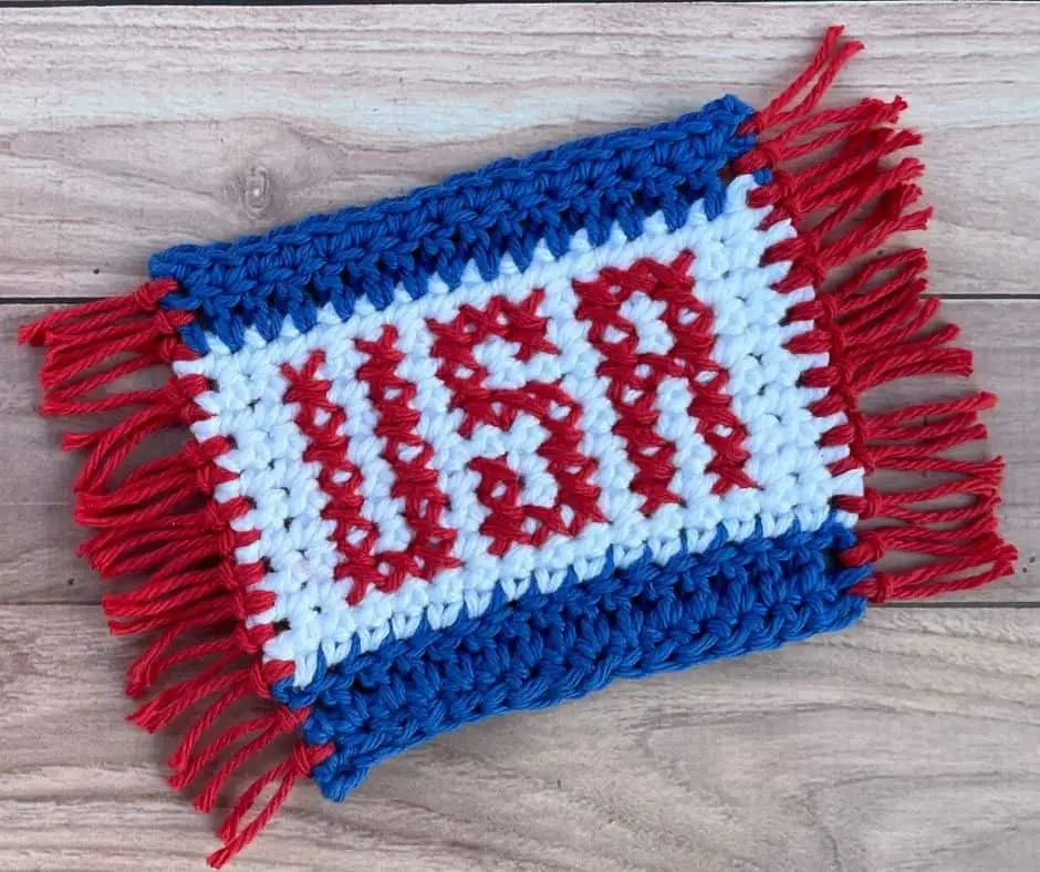 A red, white and blue crochet coaster