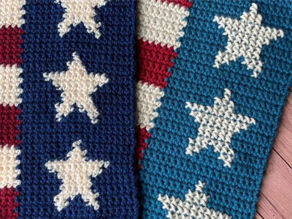 A close up of two ends of a table runner made in blue yarn with cream stars