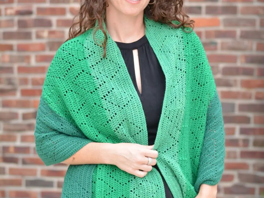 Woman wearing a lightweight crochet shawl