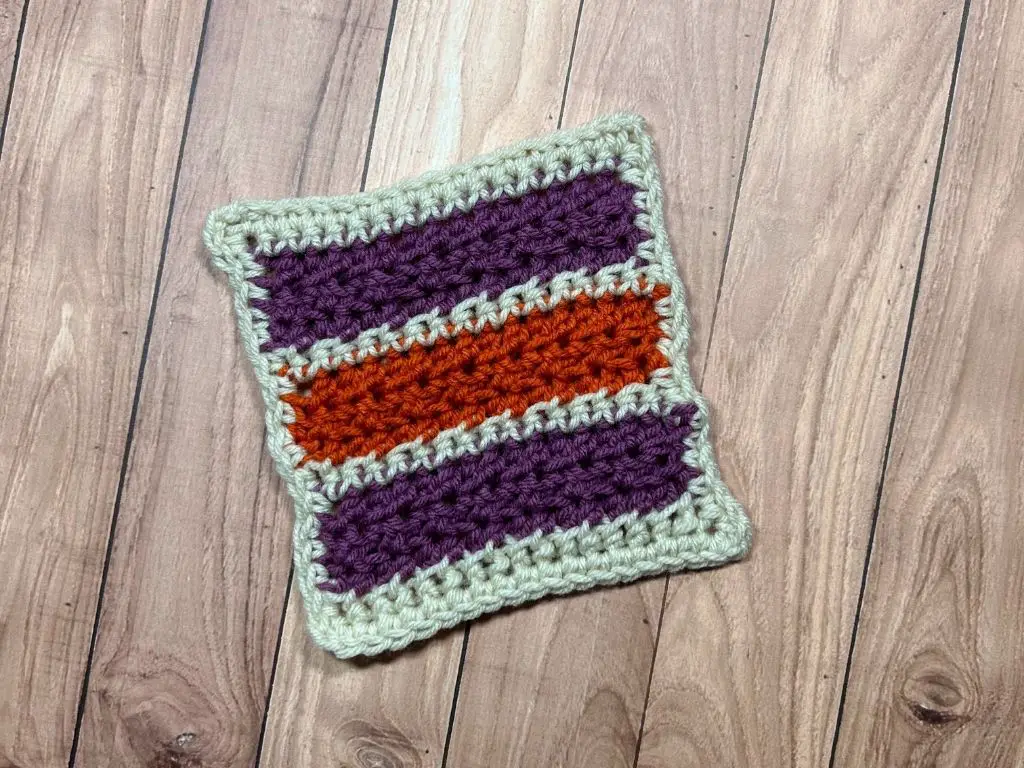 One 6-inch square of a crocheted blanket.