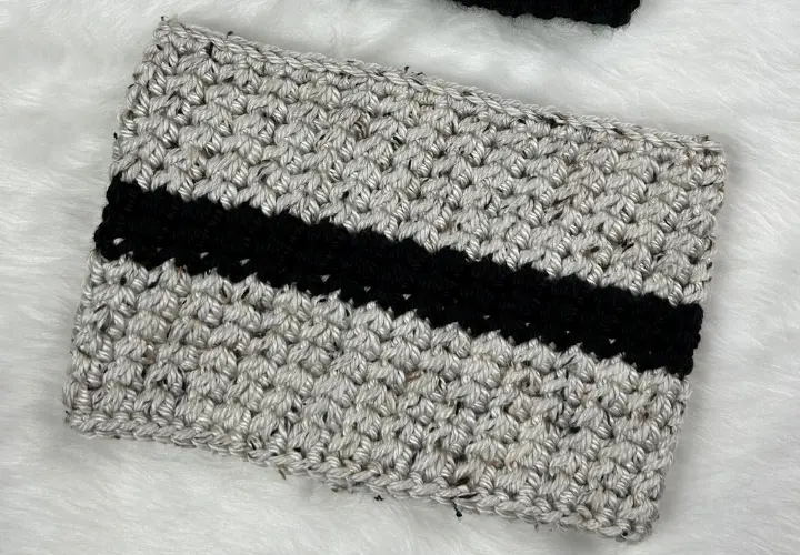 Women's extra chunky cowl crocheted with grey yarn and a black stripe in the middle