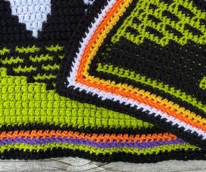 A closeup of the crochet envelope border for a Halloween mosaic crochet blanket.